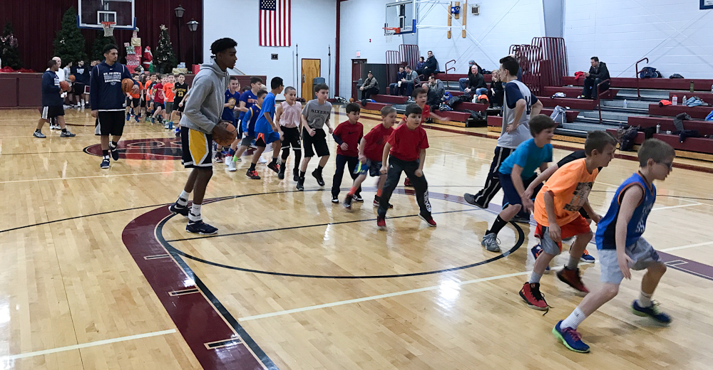 Men's Basketball Holds Free Youth Clinic at Saint Leo the Great Parish